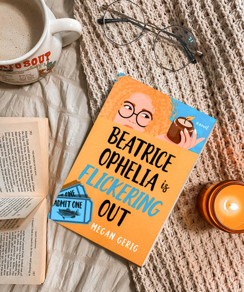 Book titled 'Beatrice Ophelia is Flickering Out' by Megan Gerig on a textured surface with a mug, glasses, and candle.