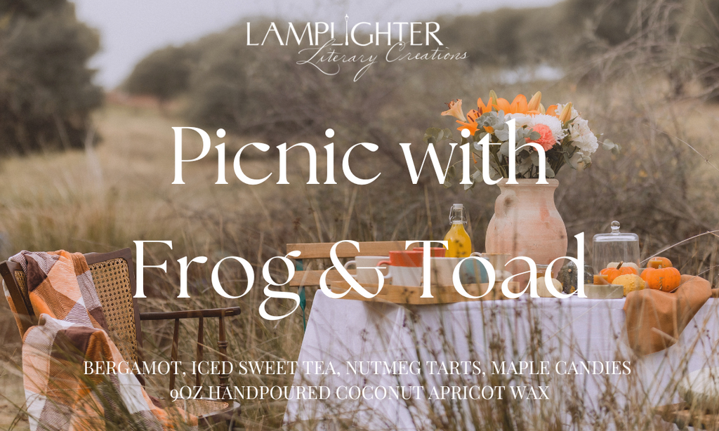 Picnic with Frog & Toad candle label with picnic in a field setting and featuring the scent notes ‘Bergamot,’ ‘Iced Sweet Tea,’ ‘Nutmeg Tarts,' and 'Maple Candies' in decorative serif lettering.